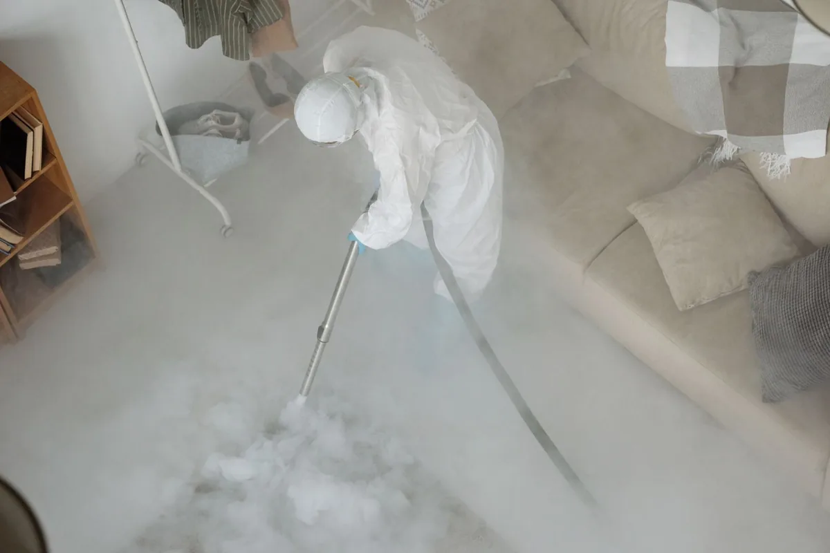 Biohazard cleanup technician in protective equipment, Ricardo, TX